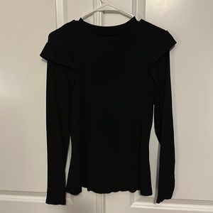 Black long sleeve top in size X-LARGE but fits more like a large.